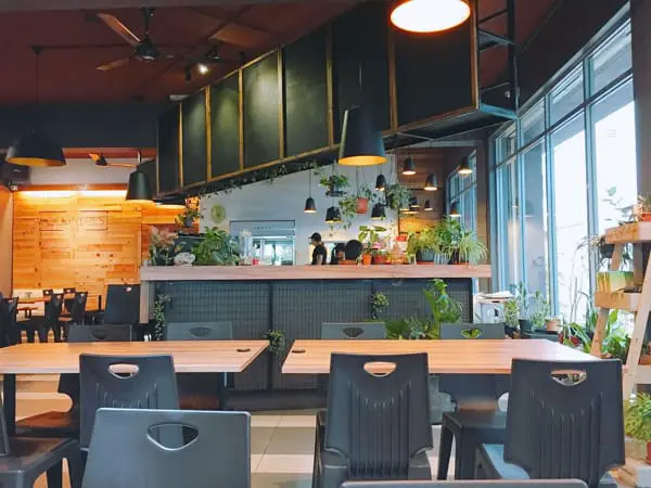 Beautiful Industrial And Plant Filled Interior Of The Woodforest Cafe In Klang