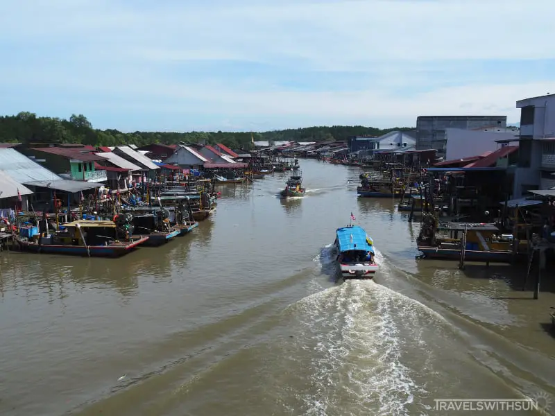 Boats Passing Under The Port Weld Scenic Bridge In Kuala Sepetang