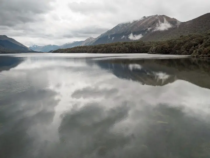 Cloudy sky reflected in Mavora Lake - more on www.travelswithsun.com
