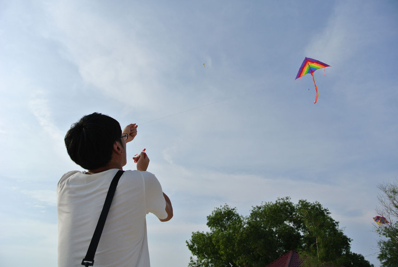 Flying a kite at Redang beach, Sekinchan