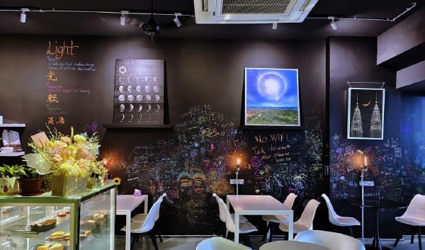 Glow In The Dark Scrawls Decorate The Interior of Lights House Cafe