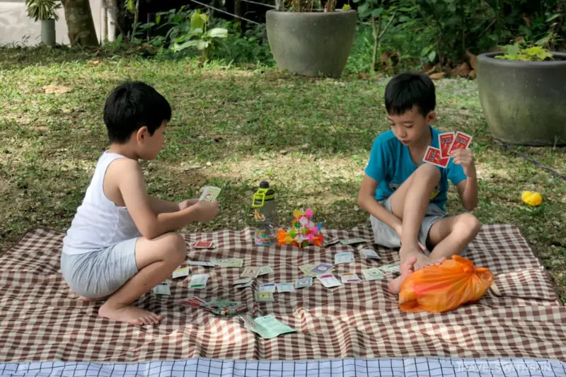 Kids Playing Games In The Shade At Summer Summer Farm