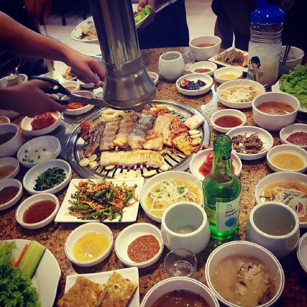 Korean BBQ Meal And Numerous Side Dishes At Han Woo Ri Korean BBQ Restaurant