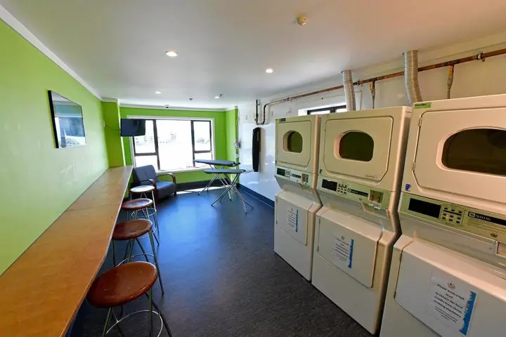 Laundry area in YHA Wellington Hostel - see more accommodation options for Wellington New Zealand on www.travelswithsun.com