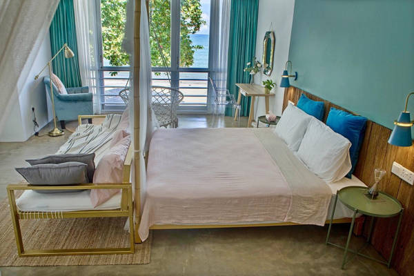 One Of The Bedrooms At Smell Rose Beach Garden Homestay