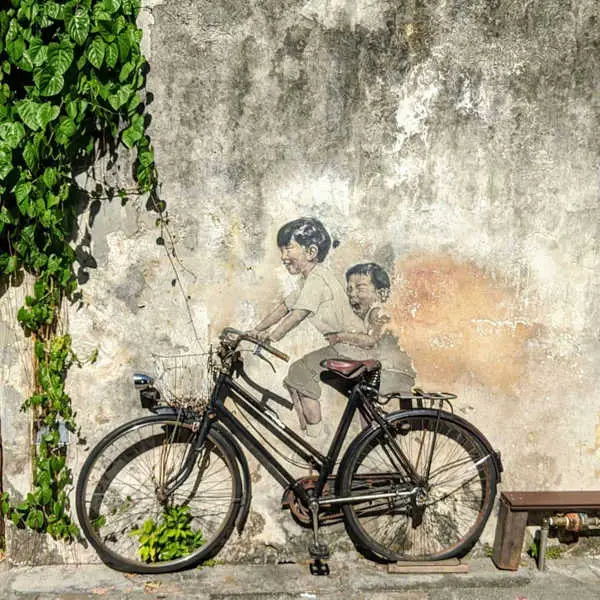 One Of The Place To Visit In Penang - Penang Street Mural Of Kids On A Bicycle