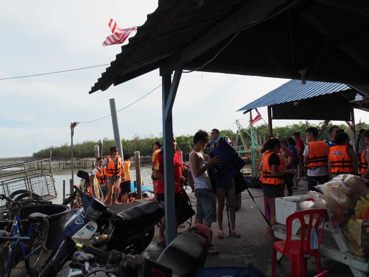 Picking out life jackets at the jetty before the boat ride to Pulau Sembilan