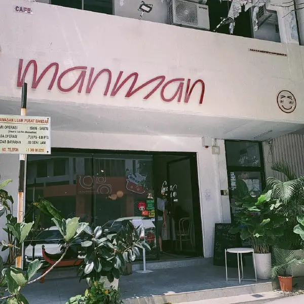 Plant Decorated Exterior of Man Man Cafe