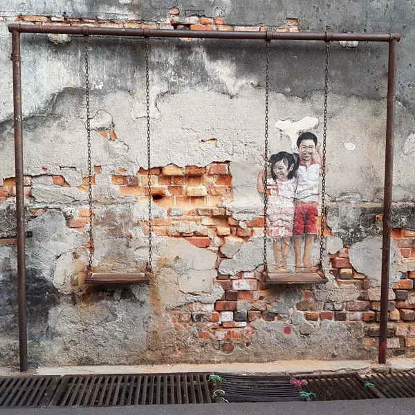 Siblings On A Swing By Louis Gan - Penang Street Art That Is A Popular Selfie Spot