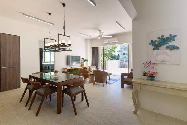 Tasteful Dining Area And Living Room At By The Sea Beach Front Apartment