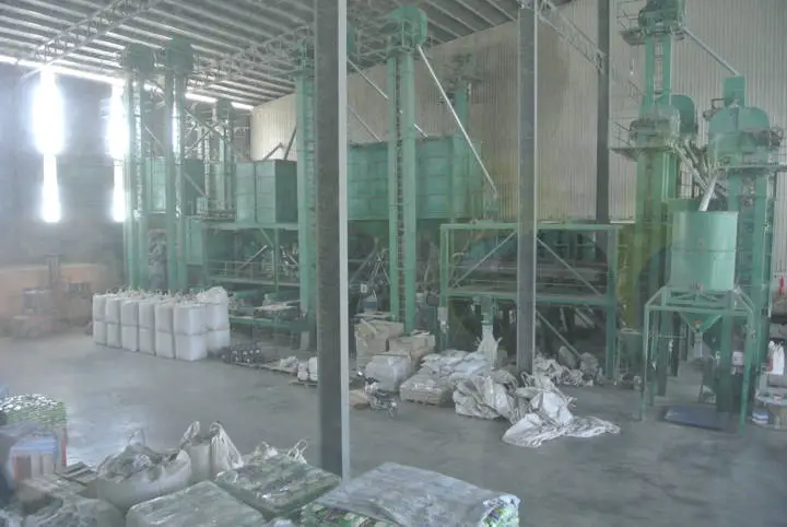 This photo was taken inside the main building from a window overlooking the machinery used, presumably to separate the husks from the actual rice kernel